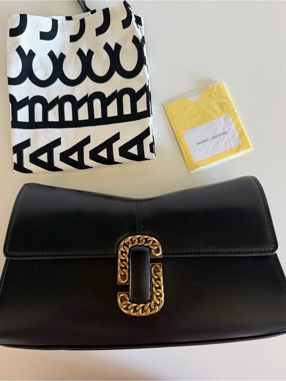 THE ST. MARC
CONVERTIBLE CLUTCH  Black Leather Shoulder Bag with Gold
Marc Jacob